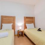 Slide Chambre avec lits simples d'un des logements