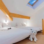 Slide Chambre avec lits double d'un des logements